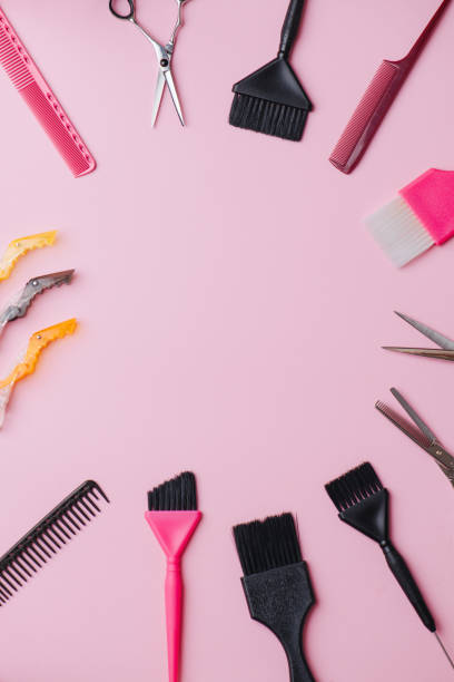 istock Nessesary tools for dyeing: brushes, scissors, combs and clips over pink. 1192840865