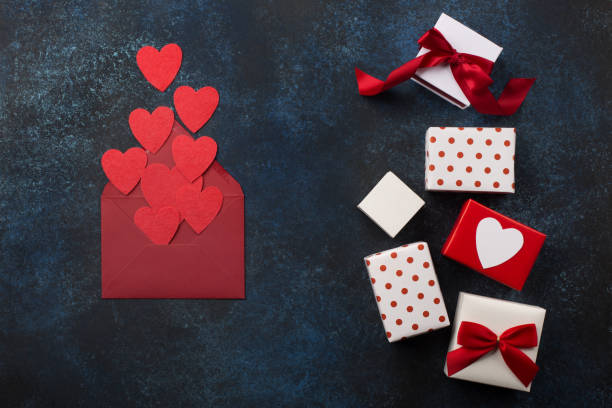 istock Red envelope, gifts and hearts on classic blue background 1192841630