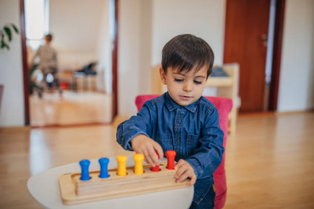 istock Little boy playing in preschool classroom 1192841712