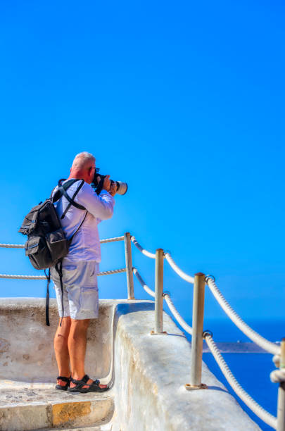 istock A mature man taking pictures on a holidays 1192843104