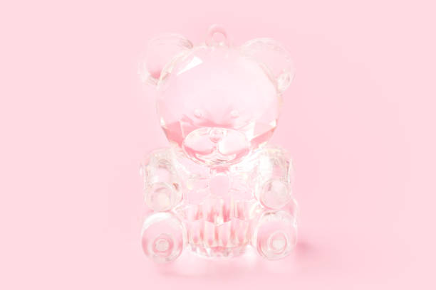 istock Cute crystal teddy bear toy on pink background 1192843268