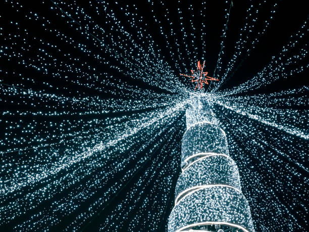 istock modern christmas tree with led lights coming down from the top of the tree 1192844377