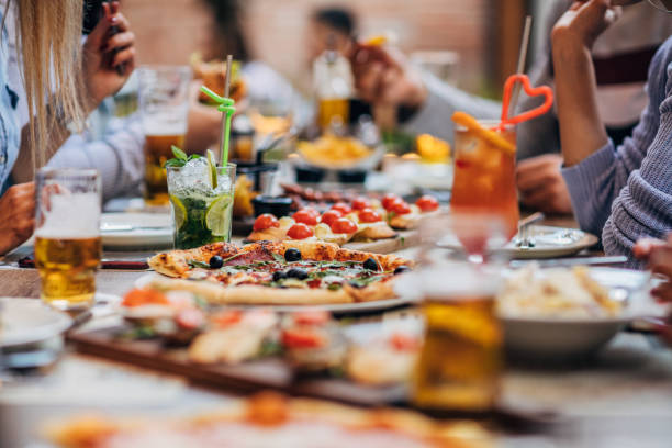 Group of friends on lunch outdoors in restaurant