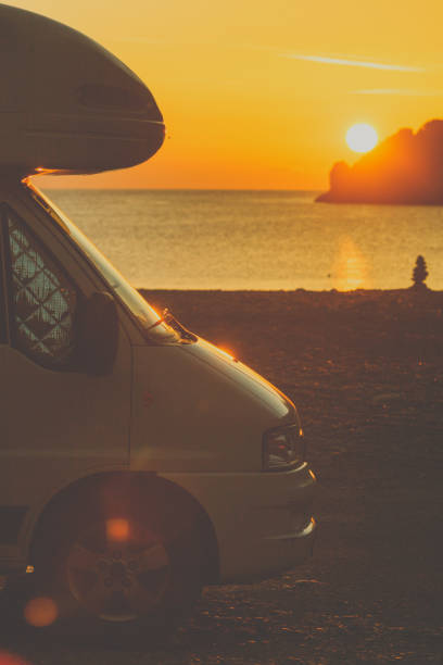 istock Camper car on nature at sunrise. Travel 1192847131