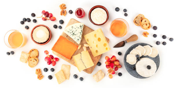 istock Cheese board panorama with wine and fruit, a flat lay, shot from the top on a white background 1192847210