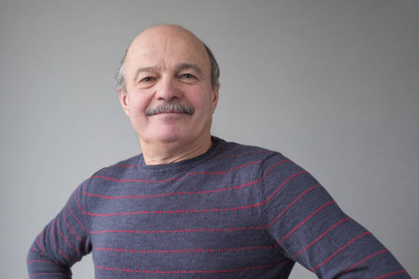istock Happy proud mature hispanic man looking at camera. 1192848660