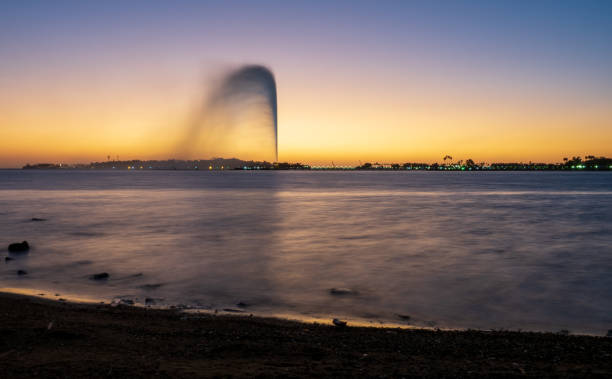 View of the King Fahd's Fountain, the world's tallest fountain, seen from the South Corniche, Jeddah, Saudi Arabia, with a beautiful sunset in the background December 8th 2019, Jeddah Saudi Arabia. The world's tallest water fountain is seen from all over the south corniche, the promenade of Jeddah. saudi arabia jeddah landscape stock pictures, royalty-free photos & images