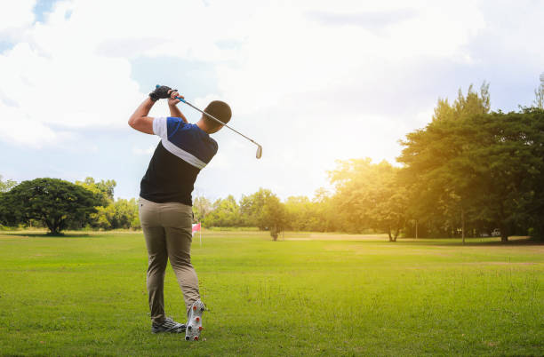 istock Full Length Of Man Playing On Golf Course 1192851595