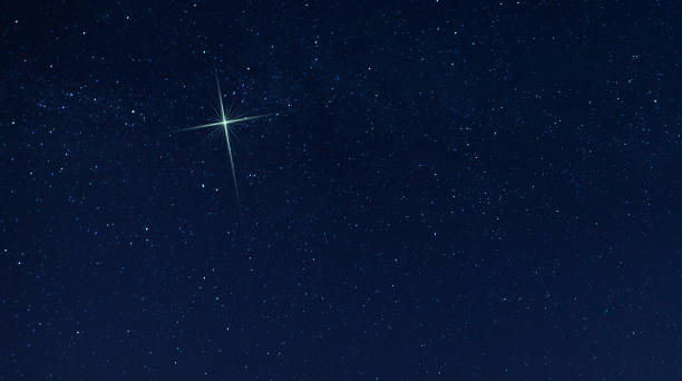 istock Christmas star in the night sky 1192851882