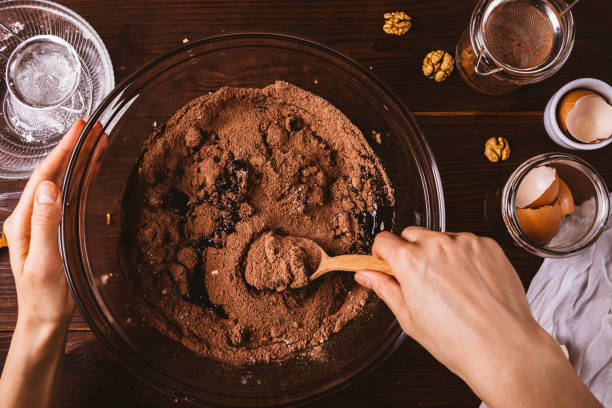 istock Woman's hands mixing melted chocolate and cocoa powder 1192853904