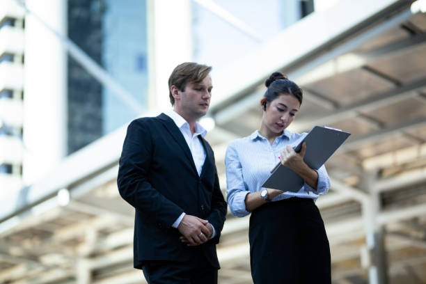 istock Business Colleagues Discussing While Standing In City 1192854141