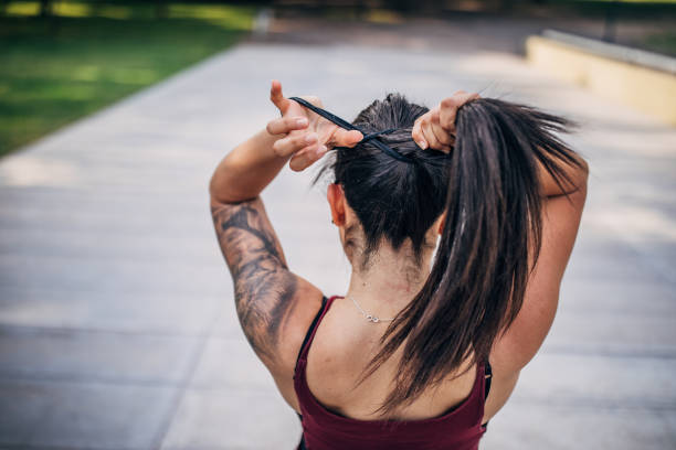 istock Beautiful young woman jogging in park. 1192854556