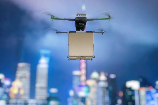 istock A flying drone transports cargo. Mixed media 1192856770