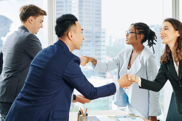 istock Business teams shaking hands 1192858449
