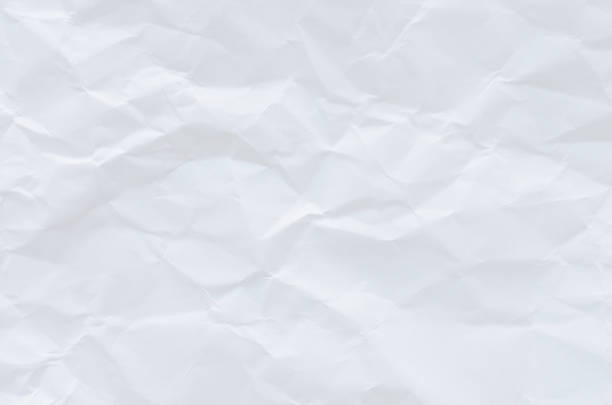 istock white crumpled paper texture background. 1192859887