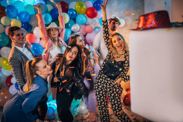 istock Happy people group photo at the party 1192859984