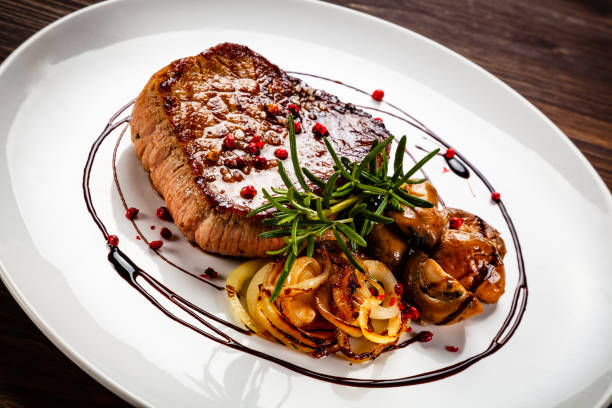 istock Beef steakwith mushroom on timber 1192861396