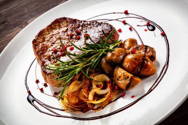 istock Beef steakwith mushroom on timber 1192861409