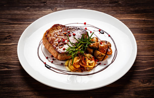istock Beef steakwith mushroom on timber 1192861439
