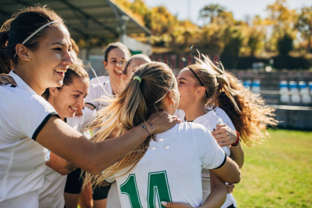 istock Women soccer team celebrating victory 1192862377