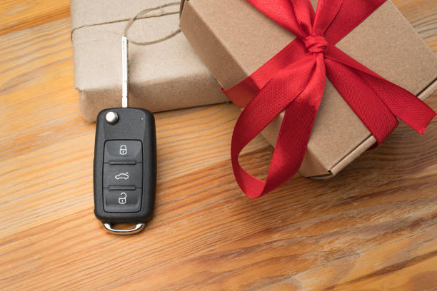 istock Car key with a paper boxes and red bow. 1192863785