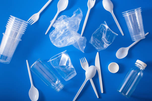 istock single use plastic bottles, cups, forks, spoons. concept of recycling plastic, plastic waste 1192863894