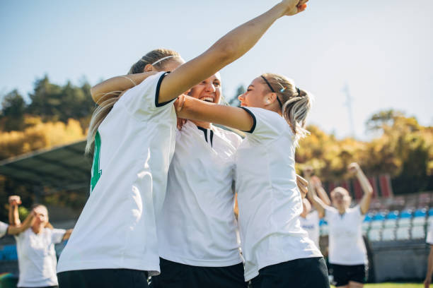 istock Women soccer team celebrating victory 1192864165