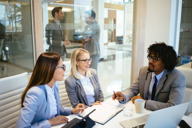 istock Team of young executives in a meeting 1192864973