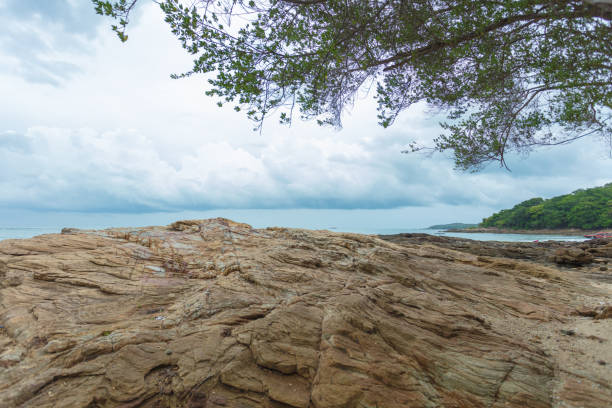 Rocks and rocks on the ocean shoreline after low tide. Very beautiful tropical landscape