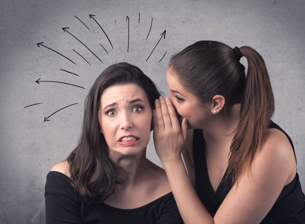 istock girl telling secret things to her girlfriend 1192865433