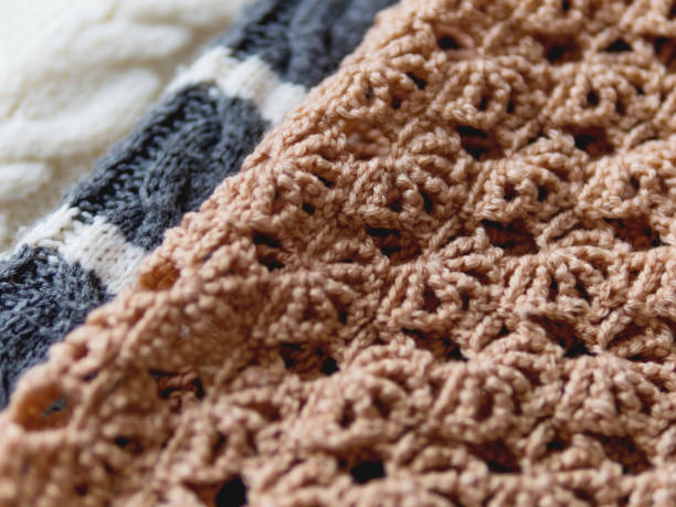 istock Grey, white and beige knitted sweaters background. Top view, flat lay. 1192866254