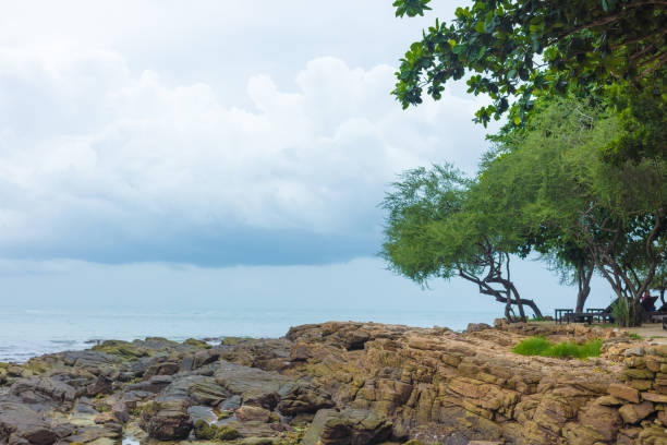 Rocks and rocks on the ocean shoreline after low tide. Very beautiful tropical landscape