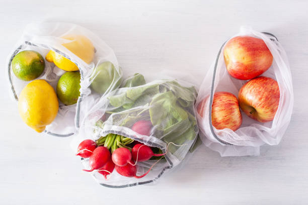 istock fruits and vegetables in reusable mesh nylon bag, plastic free zero waste concept 1192868090