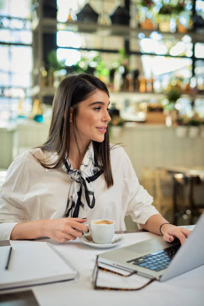 istock Businesswoman taking a break in cafe. 1192868103