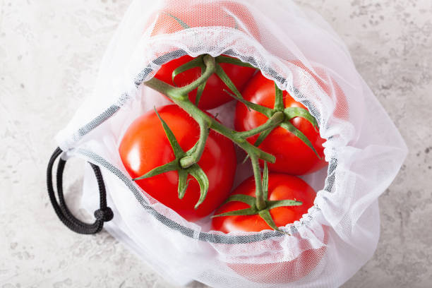 istock tomato vegetables in reusable mesh nylon bag, plastic free zero waste concept 1192868234
