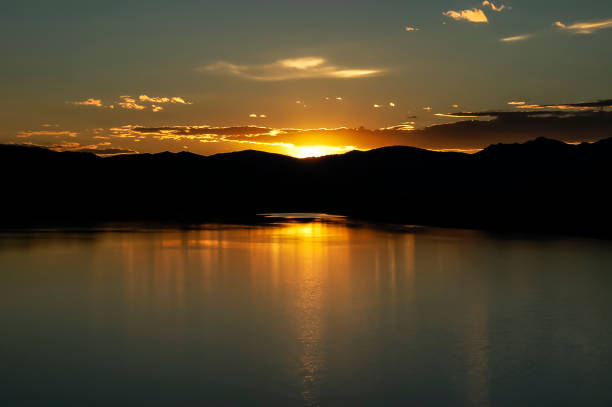 istock Flaming sunset above mountain lake 1192868344