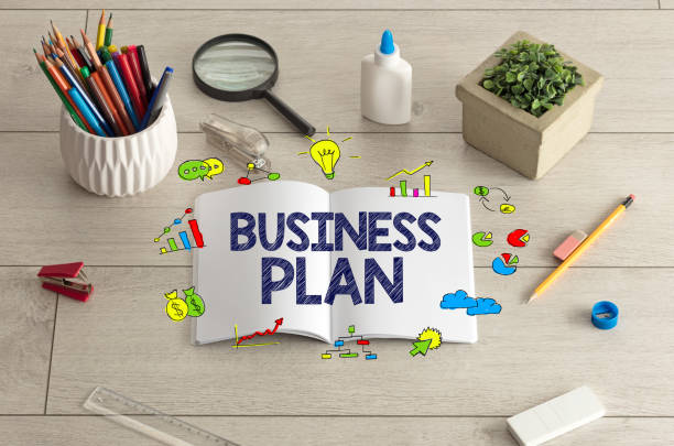 istock Notebook on the floor with office tools nearby 1192868371