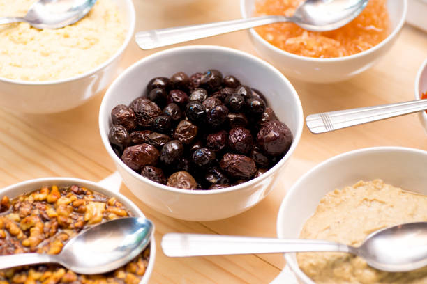 Buffet reception finger food appetizers. Olives, walnuts, honey, chutney, grapes and stuffings.