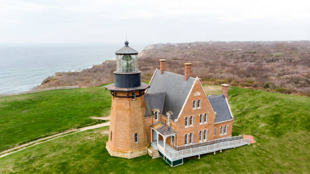 a picture of a Brick lightnouse on a cloudy day on Block Island Rhode Island