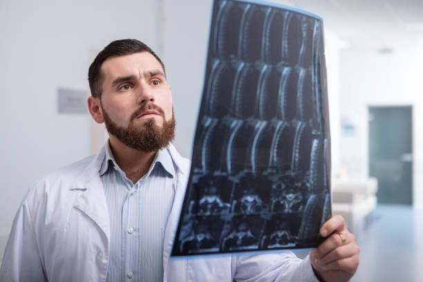 istock Young male doctor working in a modern clinic 1192869681