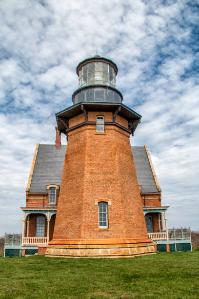 istock Brick lightnouse on a cloudy day on Block Island Rhode Island 1192870448