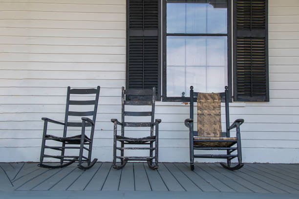 istock Wooden rocking chairs on a front porch 1192871086