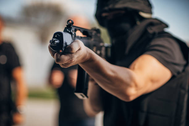 istock Special forces man aiming with rifle 1192875032