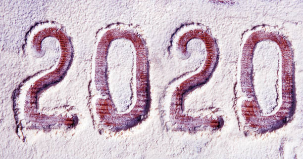 istock Inscription 2020 on a flour board (New Year background - concept) 1192875298