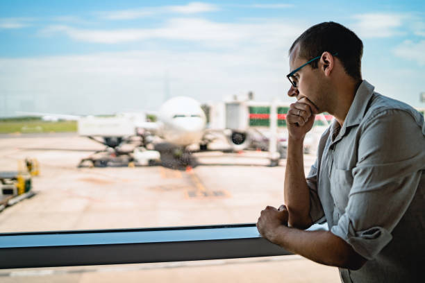istock Man on airport waiting for a flight 1192875406