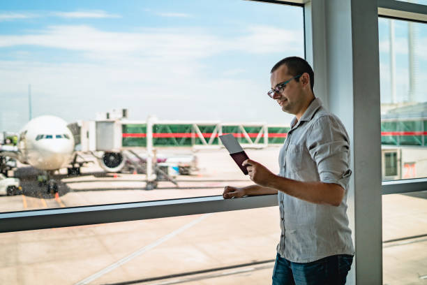 istock Man on airport waiting for a flight 1192875489