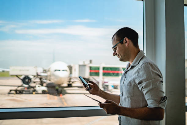istock Man on airport waiting for a flight 1192875502