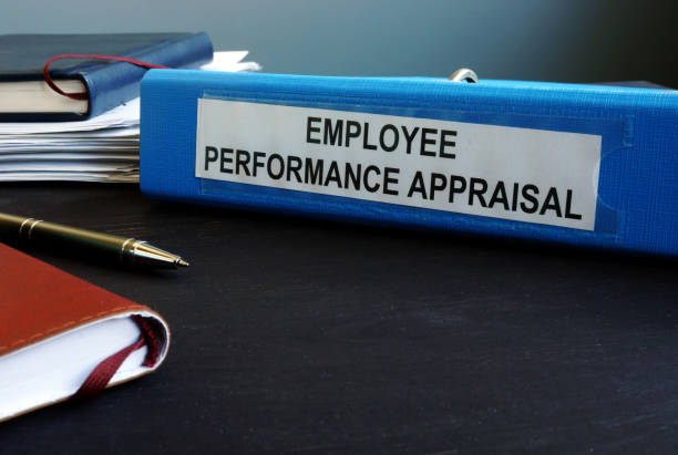istock Folder with employee performance appraisal on the desk. 1192875661
