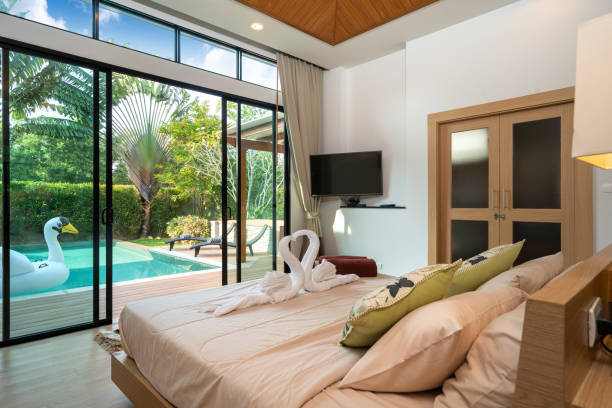 istock cosy bedroom with pool view 1192875748