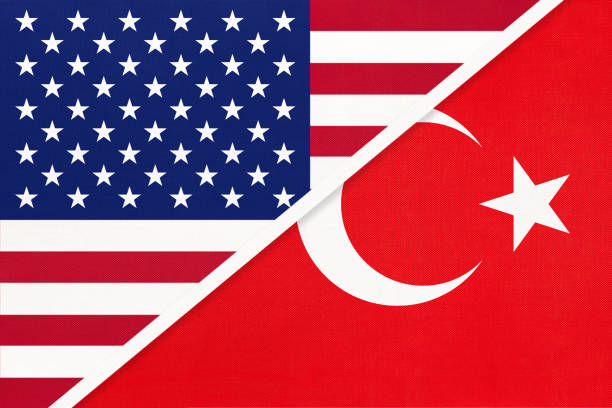 istock USA vs Turkey national flag from textile. Relationship between two american and asian countries. 1192876416